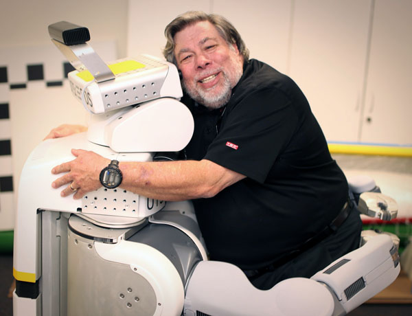 Steve Wozniak receives a hug from a PR2 robot